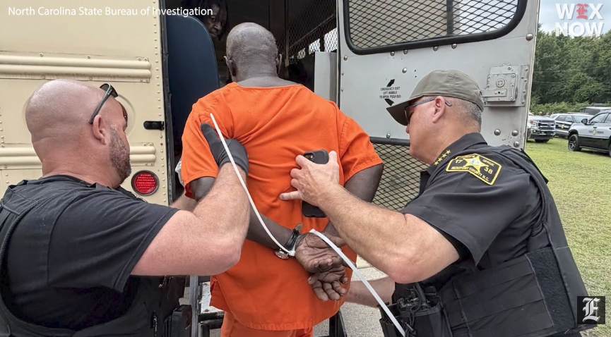 Inmate being taken into custody.